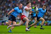 28 June 2025; Eoin McElholm of Tyrone in action against Ciarán Kilkenny of Dublin during the GAA Football All-Ireland Senior Championship quarter-final match between Dublin and Tyrone at Croke Park in Dublin. Photo by Ray McManus/Sportsfile