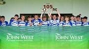 28 June 2025; Naas captains Oisin Lynch, left, and Matthew McCarthy lift the cup with team-mates after their side's victory in the Football Division 1 Cup Final match between Naas and New York at the John West Féile Peile na nÓg Gaelic Football and LGFA National Finals at Derry GAA Centre of Excellence in Owenbeg, Derry. Photo by Shauna Clinton/Sportsfile