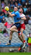 28 June 2025; Peadar Ó Cofaigh Byrne of Dublin in action against Brian Kennedy of Tyrone during the GAA Football All-Ireland Senior Championship quarter-final match between Dublin and Tyrone at Croke Park in Dublin. Photo by Ray McManus/Sportsfile