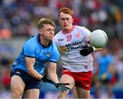 28 June 2025; Cian Murphy of Dublin in action against Seánie O'Donnell of Tyrone during the GAA Football All-Ireland Senior Championship quarter-final match between Dublin and Tyrone at Croke Park in Dublin. Photo by Ray McManus/Sportsfile