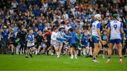 28 June 2025; Supporters run onto the pitch before the final whistle is blown in the Electric Ireland GAA Hurling All-Ireland Minor Championship final match between Waterford and Clare at FBD Semple Stadium in Thurles, Tipperary. Photo by Brendan Moran/Sportsfile