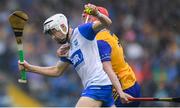 28 June 2025; Dylan Murphy of Waterford in action against Niall Doyle of Clare during the Electric Ireland GAA Hurling All-Ireland Minor Championship final match between Waterford and Clare at FBD Semple Stadium in Thurles, Tipperary. Photo by John Sheridan/Sportsfile