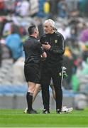 28 June 2025; Donegal manager Jim McGuinness speaks to referee Paddy Neilan after the GAA Football All-Ireland Senior Championship quarter-final match between Monaghan and Donegal at Croke Park in Dublin. Photo by Ray McManus/Sportsfile