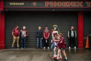 29 June 2025; Galway supporters shelter from the rain before the GAA Football All-Ireland Senior Championship quarter-final match between Meath and Galway at Croke Park in Dublin. Photo by Shauna Clinton/Sportsfile