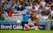 28 June 2025; Peadar Ó Cofaigh Byrne of Dublin in action against Brian Kennedy of Tyrone during the GAA Football All-Ireland Senior Championship quarter-final match between Dublin and Tyrone at Croke Park in Dublin. Photo by Ray McManus/Sportsfile
