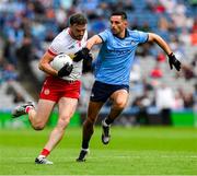28 June 2025; Brian Kennedy of Tyrone is tackled by Niall Scully of Dublin during the GAA Football All-Ireland Senior Championship quarter-final match between Dublin and Tyrone at Croke Park in Dublin. Photo by Ray McManus/Sportsfile