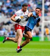 28 June 2025; Brian Kennedy of Tyrone is tackled by Niall Scully of Dublin during the GAA Football All-Ireland Senior Championship quarter-final match between Dublin and Tyrone at Croke Park in Dublin. Photo by Ray McManus/Sportsfile
