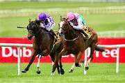29 June 2025; Sujet with Chris Hayes up, on their way to winning the Dubai Duty Free Handicap from second place Mississippi River with Ryan Moore during day three of the Dubai Duty Free Irish Derby Festival at The Curragh Racecourse in Kildare. Photo by Matt Browne/Sportsfile