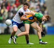 28 June 2025; Ciarán Moore of Donegal in action against Darren Hughes of Monaghan during the GAA Football All-Ireland Senior Championship quarter-final match between Monaghan and Donegal at Croke Park in Dublin. Photo by Ray McManus/Sportsfile