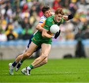 28 June 2025; Ciarán Moore of Donegal in action against Darren Hughes of Monaghan during the GAA Football All-Ireland Senior Championship quarter-final match between Monaghan and Donegal at Croke Park in Dublin. Photo by Ray McManus/Sportsfile