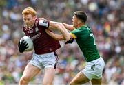29 June 2025; Peter Cooke of Galway is tackled by Ciarán Caulfield of Meath  during the GAA Football All-Ireland Senior Championship quarter-final match between Meath and Galway at Croke Park in Dublin. Photo by Ray McManus/Sportsfile