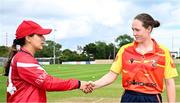29 June 2025; Dragons captain Amy Hunter, left, and Scorchers captain Christina Coulter Reilly shake hands before the Evoke Super 20 Trophy match between Scorchers and Dragons at Railway Union Cricket Club in Dublin. Photo by Seb Daly/Sportsfile