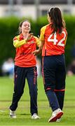 29 June 2025; Scorchers bowler Lara McBride, left, and teammate Ava Canning celebate a wicket during the Evoke Super 20 Trophy match between Typhoons and Scorchers at Railway Union Cricket Club in Dublin. Photo by Seb Daly/Sportsfile