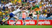 28 June 2025; Michael Langan of Donegal in action against Mícheal McCarville of Monaghan during the GAA Football All-Ireland Senior Championship quarter-final match between Monaghan and Donegal at Croke Park in Dublin. Photo by Ray McManus/Sportsfile