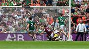 29 June 2025; Cillian McDaid of Galway shoots past Meath goalkeeper Billy Hogan to score his side's first goal during the GAA Football All-Ireland Senior Championship quarter-final match between Meath and Galway at Croke Park in Dublin. Photo by Ray McManus/Sportsfile