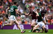 29 June 2025; Johnny McGrath of Galway is tackled by Donal Keogan of Meath during the GAA Football All-Ireland Senior Championship quarter-final match between Meath and Galway at Croke Park in Dublin. Photo by Shauna Clinton/Sportsfile