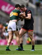 29 June 2025; Brian Ó Beaglaoich of Kerry and Oisin Conaty of Armagh tussle off the ball during the GAA Football All-Ireland Senior Championship quarter-final match between Armagh and Kerry at Croke Park in Dublin. Photo by Piaras Ó Mídheach/Sportsfile