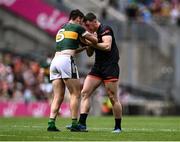 29 June 2025; Brian Ó Beaglaoich of Kerry and Oisin Conaty of Armagh tussle off the ball during the GAA Football All-Ireland Senior Championship quarter-final match between Armagh and Kerry at Croke Park in Dublin. Photo by Piaras Ó Mídheach/Sportsfile