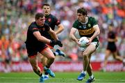 29 June 2025; Conor Geaney of Kerry in action against Paddy Burns of Armagh during the GAA Football All-Ireland Senior Championship quarter-final match between Armagh and Kerry at Croke Park in Dublin. Photo by Shauna Clinton/Sportsfile
