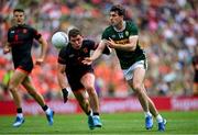 29 June 2025; Conor Geaney of Kerry in action against Paddy Burns of Armagh during the GAA Football All-Ireland Senior Championship quarter-final match between Armagh and Kerry at Croke Park in Dublin. Photo by Shauna Clinton/Sportsfile