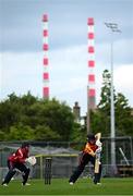 29 June 2025; Scorchers batter Christina Coulter Reilly plays a shot, watched by Dragons wicketkeeper Amy Hunter, during the Evoke Super 20 Trophy match between Scorchers and Dragons at Railway Union Cricket Club in Dublin. Photo by Seb Daly/Sportsfile