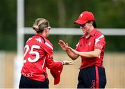 29 June 2025; Dragons bowler Bella Armstrong, left, and teammate Arlene Kelly celebrate taking the wicket of Scorchers batter Sophie MacMahon during the Evoke Super 20 Trophy match between Scorchers and Dragons at Railway Union Cricket Club in Dublin. Photo by Seb Daly/Sportsfile
