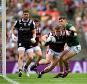 29 June 2025; Johnny McGrath of Galway in action against Eoghan Frayne of Meath during the GAA Football All-Ireland Senior Championship quarter-final match between Meath and Galway at Croke Park in Dublin. Photo by Shauna Clinton/Sportsfile