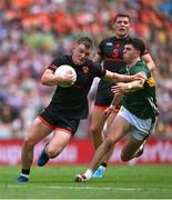 29 June 2025; Peter McGrane of Armagh in action against Dylan Casey of Kerry during the GAA Football All-Ireland Senior Championship quarter-final match between Armagh and Kerry at Croke Park in Dublin. Photo by Shauna Clinton/Sportsfile
