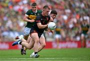 29 June 2025; Peter McGrane of Armagh in action against Dylan Casey of Kerry during the GAA Football All-Ireland Senior Championship quarter-final match between Armagh and Kerry at Croke Park in Dublin. Photo by Shauna Clinton/Sportsfile