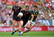 29 June 2025; Peter McGrane of Armagh in action against Dylan Casey of Kerry during the GAA Football All-Ireland Senior Championship quarter-final match between Armagh and Kerry at Croke Park in Dublin. Photo by Shauna Clinton/Sportsfile