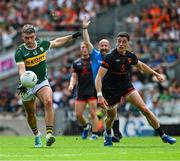 29 June 2025; Graham O'Sullivan of Kerry in action against Rory Grugan of Armagh during the GAA Football All-Ireland Senior Championship quarter-final match between Armagh and Kerry at Croke Park in Dublin. Photo by Ray McManus/Sportsfile