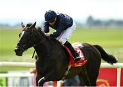 29 June 2025; Lambourn, with Ryan Moore up, on their way to winning the Dubai Duty Free Irish Derby during day three of the Dubai Duty Free Irish Derby Festival at The Curragh Racecourse in Kildare. Photo by Matt Browne/Sportsfile