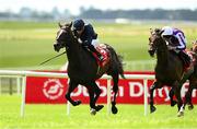 29 June 2025; Lambourn, with Ryan Moore up, on their way to winning the Dubai Duty Free Irish Derby from second place Serious Contender with Gavin Ryan during day three of the Dubai Duty Free Irish Derby Festival at The Curragh Racecourse in Kildare. Photo by Matt Browne/Sportsfile