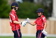 29 June 2025; Dragons batters Orla Prendergast, left, and Amy Hunter during the Evoke Super 20 Trophy match between Scorchers and Dragons at Railway Union Cricket Club in Dublin. Photo by Seb Daly/Sportsfile
