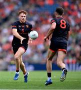29 June 2025; Jason Duffy of Armagh makes a pass to team-mate Niall Grimley during the GAA Football All-Ireland Senior Championship quarter-final match between Armagh and Kerry at Croke Park in Dublin. Photo by Shauna Clinton/Sportsfile
