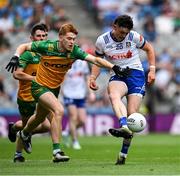 28 June 2025; Gary Mohan of Monaghan in action against Ciarán Moore of Donegal during the GAA Football All-Ireland Senior Championship quarter-final match between Monaghan and Donegal at Croke Park in Dublin. Photo by Ray McManus/Sportsfile