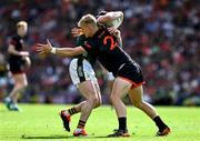 29 June 2025; Paul Murphy of Kerry is tackled by Cian McConville of Armagh during the GAA Football All-Ireland Senior Championship quarter-final match between Armagh and Kerry at Croke Park in Dublin. Photo by Ray McManus/Sportsfile