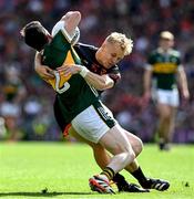 29 June 2025; Paul Murphy of Kerry is tackled by Cian McConville of Armagh during the GAA Football All-Ireland Senior Championship quarter-final match between Armagh and Kerry at Croke Park in Dublin. Photo by Ray McManus/Sportsfile