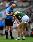 29 June 2025; Referee Brendan Cawley check on the welfare of David Clifford of Kerry after he had been fouled during the GAA Football All-Ireland Senior Championship quarter-final match between Armagh and Kerry at Croke Park in Dublin. Photo by Ray McManus/Sportsfile
