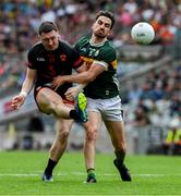 29 June 2025; Oisin Conaty of Armagh is tackled by Brian Ó Beaglaoich of Kerry during the GAA Football All-Ireland Senior Championship quarter-final match between Armagh and Kerry at Croke Park in Dublin. Photo by Ray McManus/Sportsfile