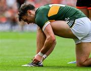 29 June 2025; David Clifford of Kerry ties his boot laces during the GAA Football All-Ireland Senior Championship quarter-final match between Armagh and Kerry at Croke Park in Dublin. Photo by Ray McManus/Sportsfile