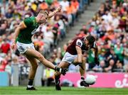 29 June 2025; Conor Gray of Meath shoots past Seán Fitzgerald of Galway to score a goal during the GAA Football All-Ireland Senior Championship quarter-final match between Meath and Galway at Croke Park in Dublin. Photo by Ray McManus/Sportsfile