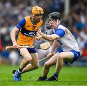 28 June 2025; Ian O'Brien of Clare in action against Conor Lynch of Waterford during the Electric Ireland GAA Hurling All-Ireland Minor Championship final match between Waterford and Clare at FBD Semple Stadium in Thurles, Tipperary. Photo by Brendan Moran/Sportsfile