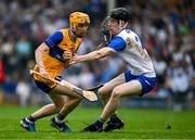 28 June 2025; Ian O'Brien of Clare in action against Conor Lynch of Waterford during the Electric Ireland GAA Hurling All-Ireland Minor Championship final match between Waterford and Clare at FBD Semple Stadium in Thurles, Tipperary. Photo by Brendan Moran/Sportsfile