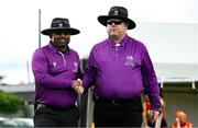 29 June 2025; Umpires Azam Ali Baig, left, and Willie Clarke before the Evoke Super 20 Trophy match between Scorchers and Dragons at Railway Union Cricket Club in Dublin. Photo by Seb Daly/Sportsfile