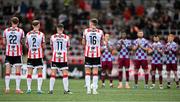 27 June 2025; Players from both teams observe a minute's silence in honour of the late Mary Higgins, mother of former Derry City manager Ruaidhri Higgins, before the SSE Airtricity Men's Premier Division match between Derry City and Drogheda United at The Ryan McBride Brandywell Stadium in Derry. Photo by Shauna Clinton/Sportsfile