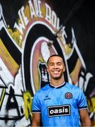 1 July 2025; Bohemians new signing Douglas James-Taylor poses for a portrait in the newly launched Oasis themed Bohemians jersey during his announcement at Dalymount Park in Dublin. Photo by Ramsey Cardy/Sportsfile
