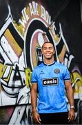 1 July 2025; Bohemians new signing Douglas James-Taylor poses for a portrait in the newly launched Oasis themed Bohemians jersey during his announcement at Dalymount Park in Dublin. Photo by Ramsey Cardy/Sportsfile
