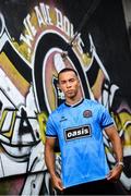 1 July 2025; Bohemians new signing Douglas James-Taylor poses for a portrait in the newly launched Oasis themed Bohemians jersey during his announcement at Dalymount Park in Dublin. Photo by Ramsey Cardy/Sportsfile