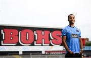 1 July 2025; Bohemians new signing Douglas James-Taylor poses for a portrait in the newly launched Oasis themed Bohemians jersey during his announcement at Dalymount Park in Dublin. Photo by Ramsey Cardy/Sportsfile